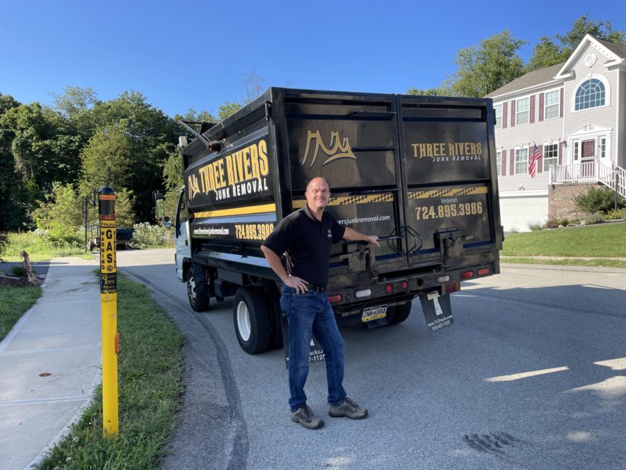 junk removal pro standing by three rivers junk removal truck